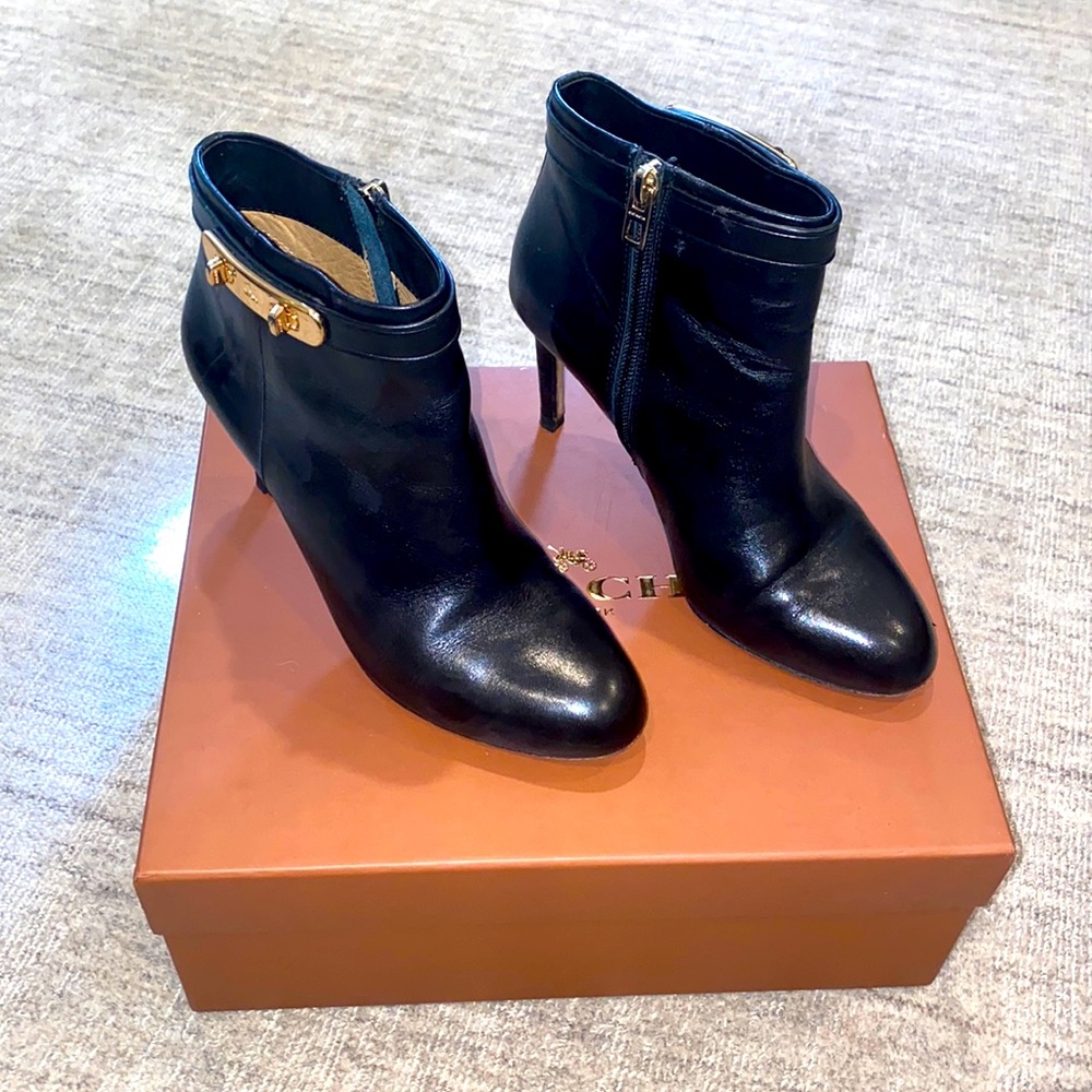 Coach Regina soft shine calf black leather bootie with gold buckle.